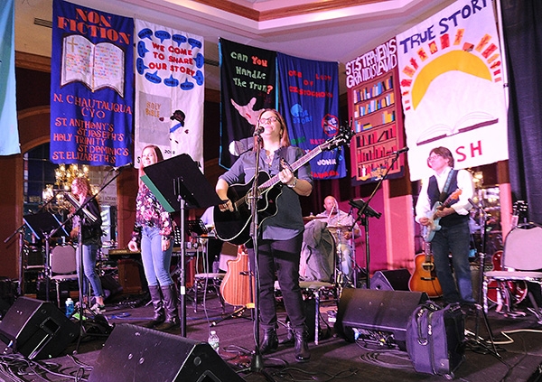 Area Catholic teens sing, dance and rejoice to the sounds of the Carrie Ford band during 